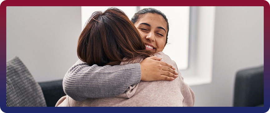 Women Hugging Photo on Victim Assistance Page